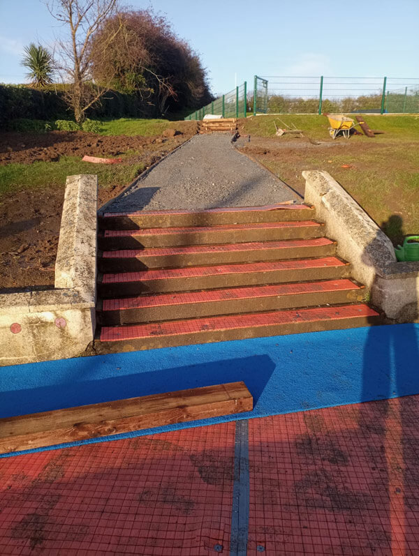 steps in school payground before artificial grass