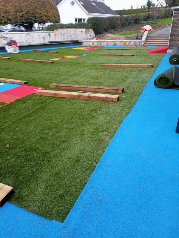 image of school playground installation with artificial grass