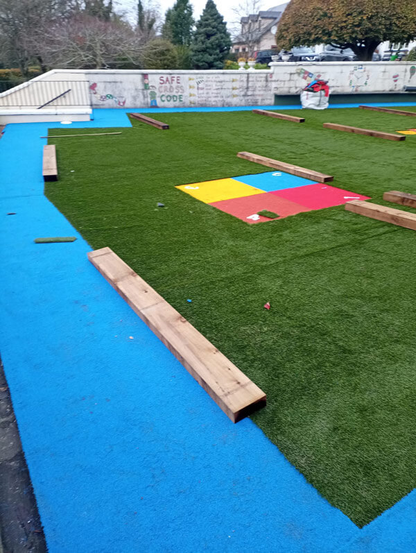 image of school playground installation with artificial grass